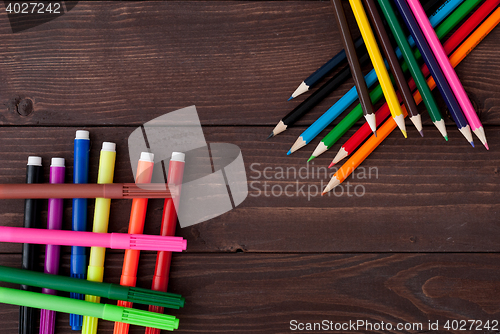 Image of Colored pencils on a wooden board