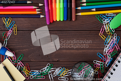 Image of School supplies on a wooden table