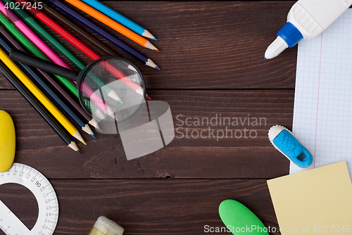 Image of School supplies on a wooden table