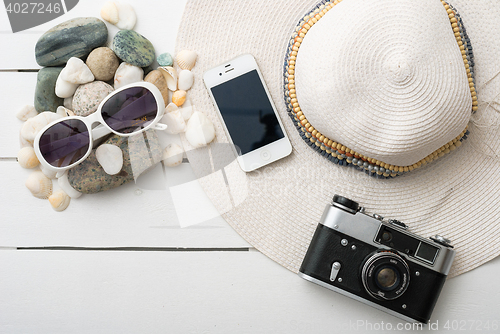 Image of Beach accessories on wooden board