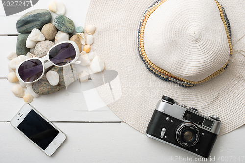 Image of Beach accessories on wooden board