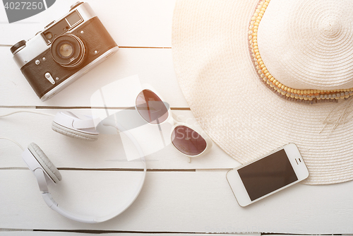 Image of Beach accessories on wooden board