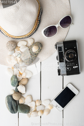 Image of Beach accessories on wooden board