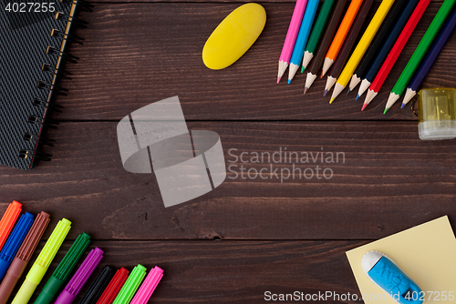 Image of School supplies on a wooden table