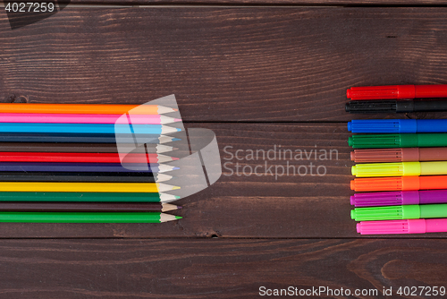 Image of Colored pencils on a wooden board