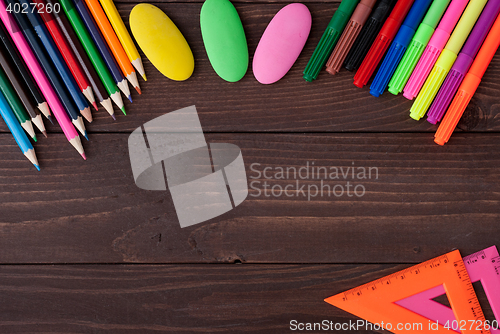 Image of School supplies on a wooden table