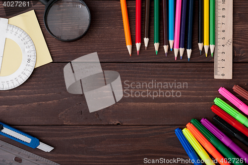 Image of School supplies on a wooden table