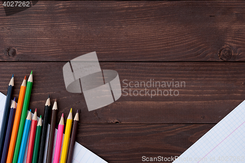 Image of Colored pencils on a wooden board