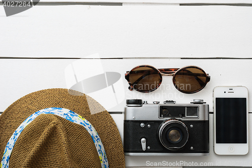 Image of Beach accessories on wooden board