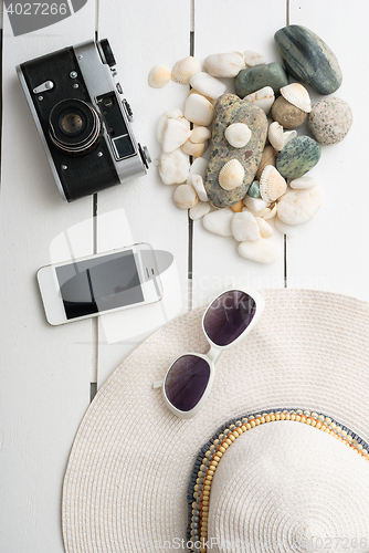 Image of Beach accessories on wooden board