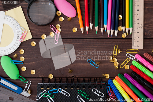 Image of School supplies on a wooden table