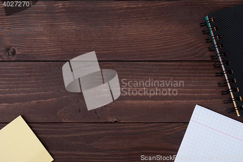 Image of School supplies on a wooden table