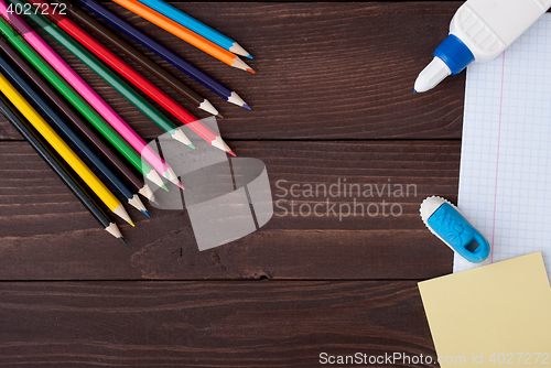 Image of School supplies on a wooden table