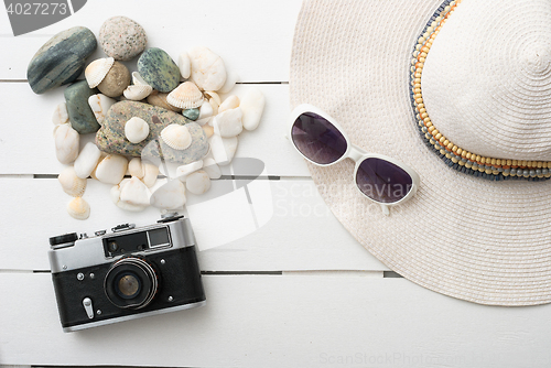 Image of Beach accessories on wooden board