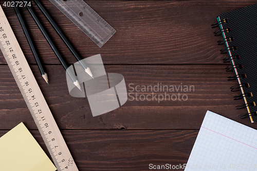 Image of School supplies on a wooden table