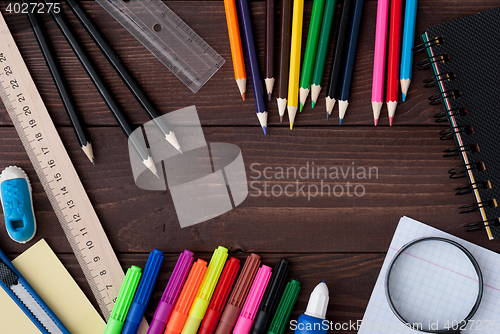 Image of School supplies on a wooden table