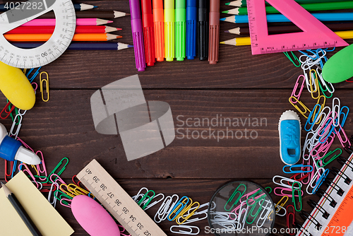 Image of School supplies on a wooden table