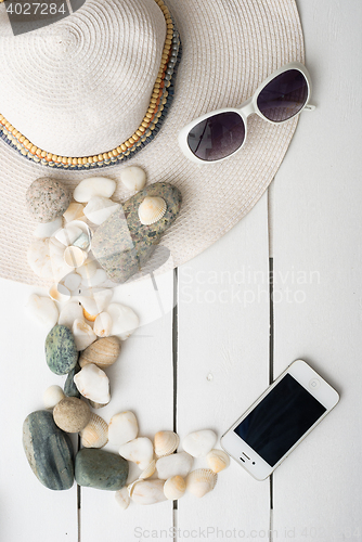 Image of Beach accessories on wooden board
