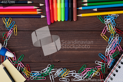 Image of School supplies on a wooden table