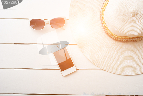 Image of Beach accessories on wooden board