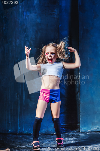 Image of The funny crasy girl on dark background