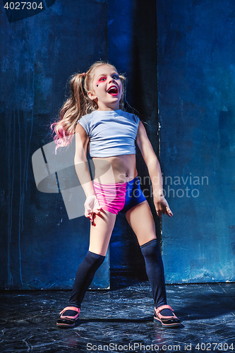 Image of The funny crasy girl on dark background