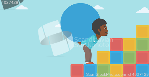 Image of Man carrying concrete ball uphill.