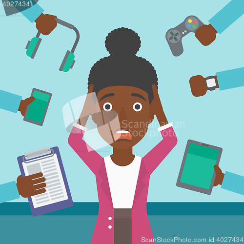 Image of Woman surrounded with her gadgets.