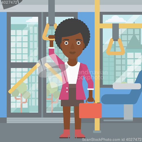 Image of Woman traveling by public transport.