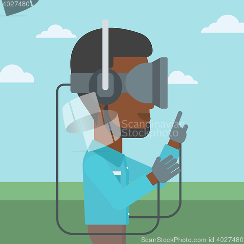 Image of Man in virtual reality headset playing video game.