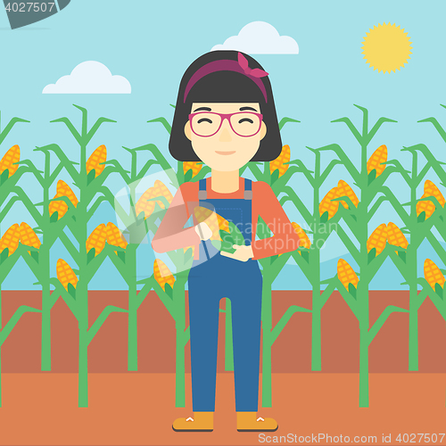 Image of Female farmer holding corn vector illustration.