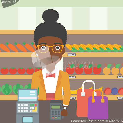 Image of Woman paying wireless with smart watch.