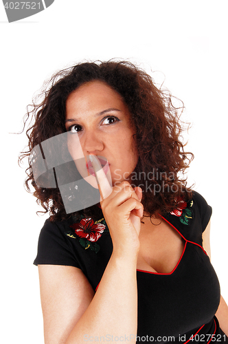 Image of Woman whit finger over mouth.