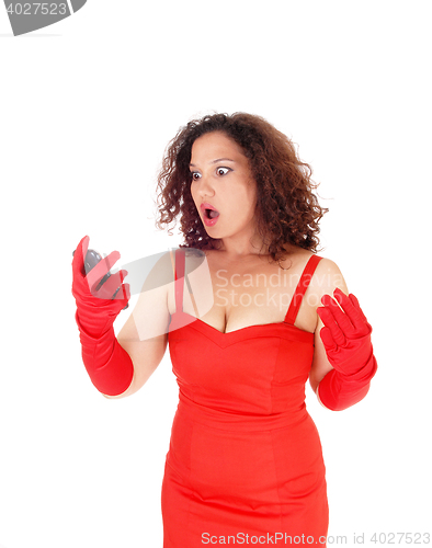 Image of Very surprised woman in dress.