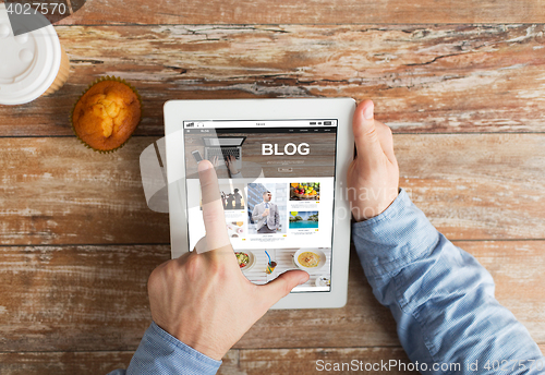 Image of close up of hands with internet blog on tablet pc