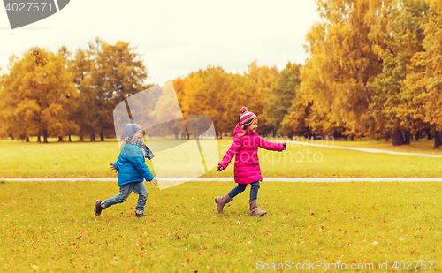 Image of group of happy little kids running outdoors