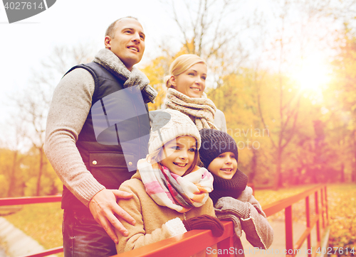 Image of happy family in autumn park