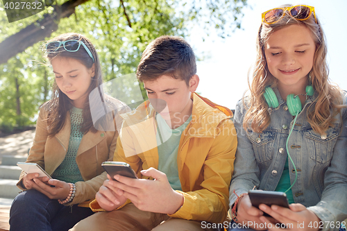 Image of teenage friends with smartphone and headphones