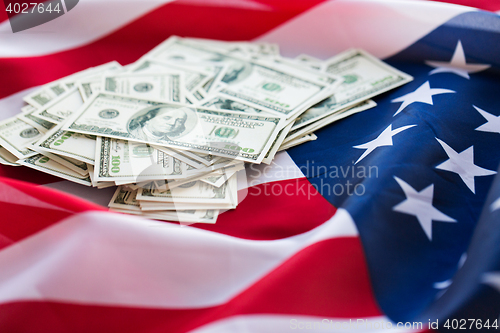 Image of close up of american flag and dollar cash money