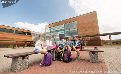 Image of group of happy elementary school students outdoors