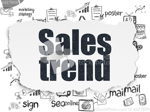 Image of Marketing concept: Sales Trend on Torn Paper background
