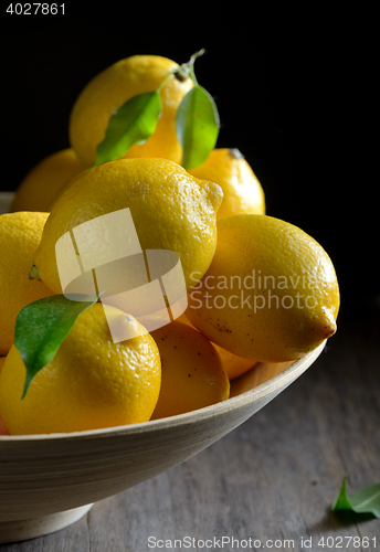 Image of lemons on an old wooden table