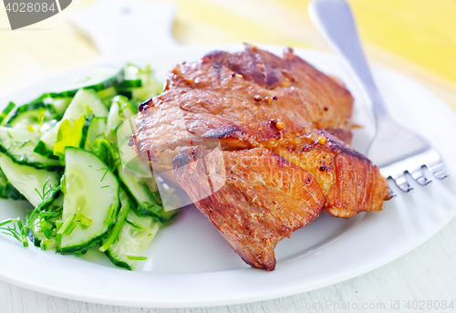 Image of meat with salad