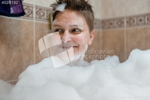 Image of Happy woman in bath