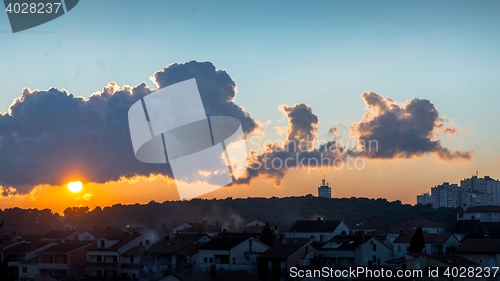 Image of Sunset over village