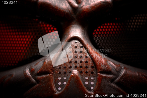 Image of Steel mask covered with rust closeup