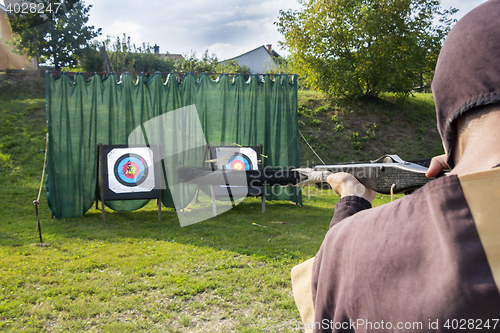 Image of Medieval archer to use a crossbow and shoot at a target