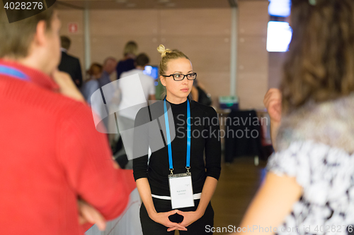 Image of People interacting during coffee break at medical conference.