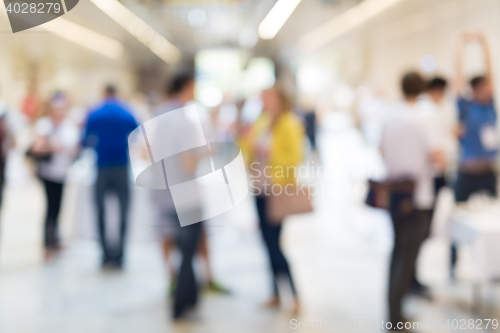 Image of Abstract blurred people socializing during coffee break at business conference.