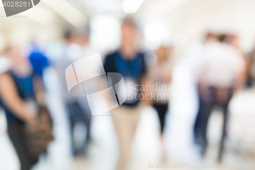 Image of Abstract blurred people socializing during coffee break at business conference.